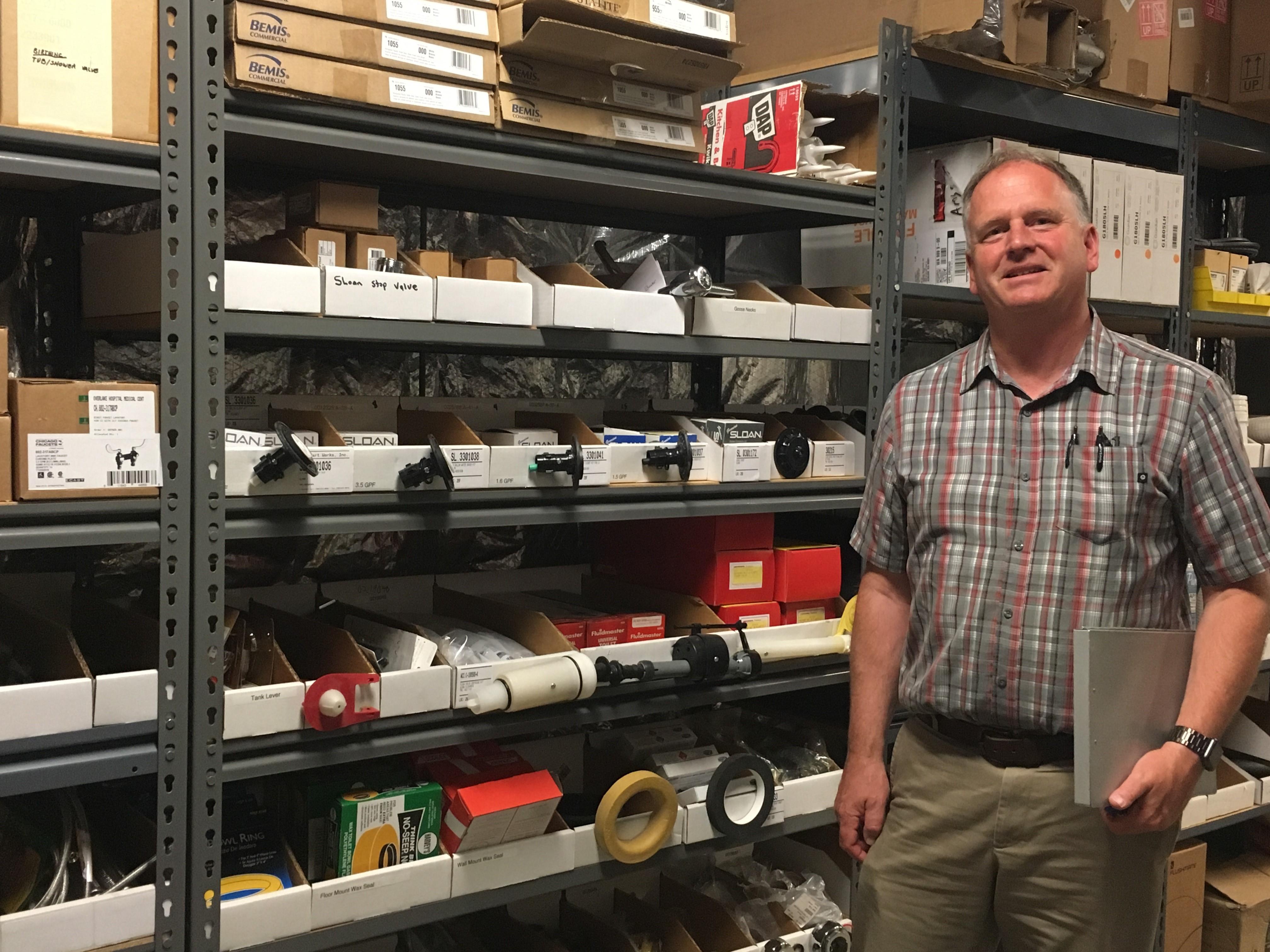 Chris showing one of The Part Work’s Vendor-Maintained Inventory shelves.